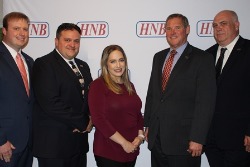 4 HNB staff take picture with David Raven president of HNB.